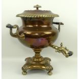 A 19th century copper and brass samovar, raised on a footed base, 40cm.