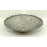 A Liberty & Co Tudric pewter fruit bowl, circa 1900, with a hammered finish and repeating scroll