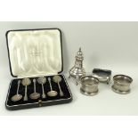 A set of six silver coffee spoons, Birmingham 1934, cased, pair of napkin rings, Birmingham 1934, a