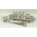 A George III silver and cut glass desk set, the tray with double shell handles and a gadrooned rim,