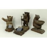 A group of three Black Forest bears, each figure modelled with a brass bowl, 16cm, 15cm, and 12cm