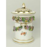 A Meissen porcelain pot pourri pot, inner lid and pierced cover, late 19th century, encrusted with