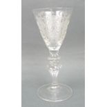 A European wine glass, circa 1750, the funnel funnel shaped bowl engraved with a coat of arms,