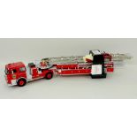 A Franklin Mint model, scale 1:32, of a 1985 Seagrave Aerial Ladder Fire Truck, mint and boxed.