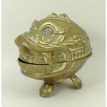A South East Asian brass incense burner modelled as a mythical beast with tripod feet, 11cm high.