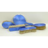 A silver and blue guilloche enamel dressing table set, Birmingham 1922, comprising; hand mirror,