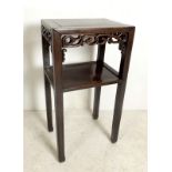 A Chinese hardwood square two tier jardiniere stand with leaf scroll decoration, 42 by 31 by 80cm