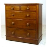 A Victorian mahogany chest of two short over three long graduated drawers with turned and inlaid