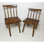 Two elm milking chairs with stick backs and square seats, larger 47 by 49 by 80cm high. (2)