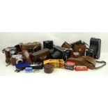 A collection of vintage cameras, including a Zeiss Ikon, Ikonta camera, no 1208, a Voigtlander