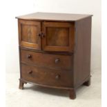 A Victorian mahogany bow front pot cupboard, with two drawers below, turned handles, raised on