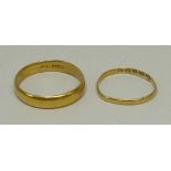 A 22ct gold wedding band, size O, and a further wedding band, size T/U, 6.6g.