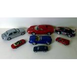 A Burago 1/18 scale Ferrari 250 Le Mans, Cobra 427 1/24, a Welly Jaguar plus four smaller. (7)