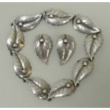 A Christian Fogh, Denmark, silver bracelet formed of repeating leaves, and a pair of matching clip