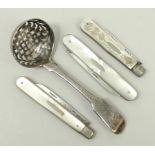 A George III sugar sifting spoon, crest engraved, William Sumner, London 1788, and three silver and