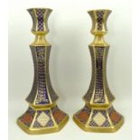 A pair of Caverswall porcelain candlesticks of hexagonal baluster form imari decorated in the