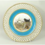 A Mintons porcelain plate, late 19th century, for John Mortlock, painted centrally with terriers