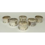 A set of six silver napkin rings with engraved numbers, Birmingham 1945, 8.555toz.