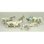 A group of Basil Matthews pottery figures, mid 20th century, painted with flowers, comprising; pair