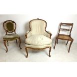 A late 19th century French walnut fauteuil, Louis XV style, with carved framed and cabriole legs,