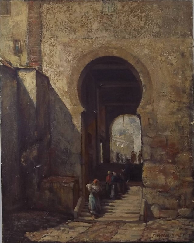 E H Macandrew:(British b.1877): an Arabian street scene, with figures in the foreground climbing