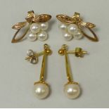 A pair of Mikimoto 9ct gold and cultured pearl earrings in a leaf and berry design, and a pair of