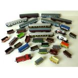 A quantity of Wren, Lima and other N gauge railway carriages and goods wagons.