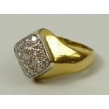 An 18ct gold and diamond cluster ring in a lozenge shaped design, approximately 0.3ct, size J,