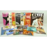 A collection of vinyl LP's and singles, including twenty five Elvis LP's, including 'Loving You',