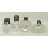 A group of Victorian and later cut glass scent bottles with silver lids, London 1863, Birmingham