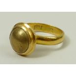 A Tudor style 15ct gold and lacquered gilt cabochon ring, late 19th century, size J, 8.4g.