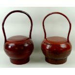 Two Chinese red lacquered gourd shaped rice carriers, 30 by 45cm high.