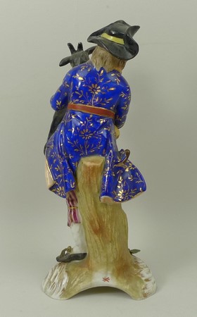 A Sitzendorf porcelain figure, late 19th century, modelled as a boy holding a goat and pan pipes, - Image 2 of 3