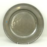 An 18th century pewter charger, bears indistinct touch marks verso, 38cm diameter.