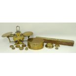 A 19th century set of brass letter scales and weights, a brass and mahogany spirit level, and a