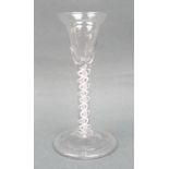 A George III wine glass, circa 1760, the pan topped bowl above a double opaque twist stem, raised