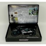 A Minichamps 'The Great Escape' Triumph TR6 1960 scale 1:12 model, mint and boxed.