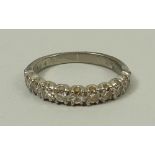 An 18ct white gold and diamond half hoop eternity ring, approximately 0.4ct, size I, 2.8g.