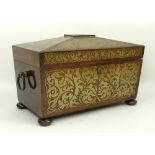 A Regency rosewood and brass inlaid tea caddy of sarcophagus form, twin ring handles, opening to