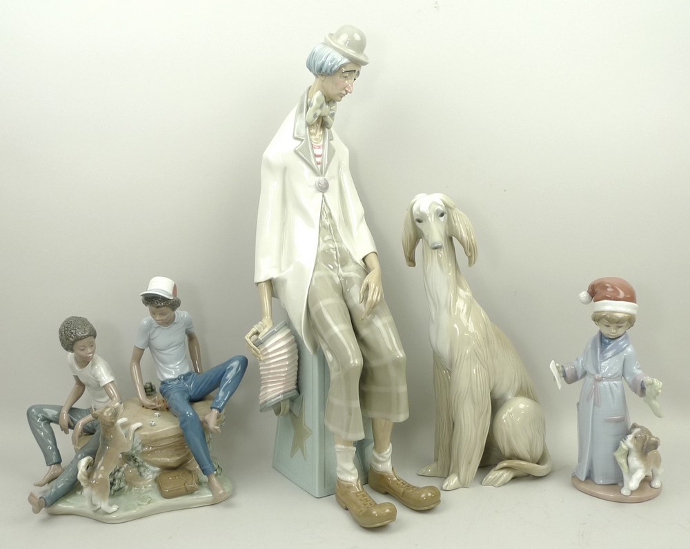 A group of Lladro porcelain figures, comprising; an Afghan hound, 30cm high, melancholy clown, 47cm