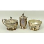 A silver three piece condiment set of circular, footed form, with frosted clear glass liners,
