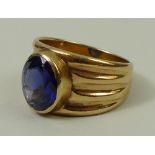 A USAF 10ct gold ring set with a synthetic sapphire, size T/U, 10.5g.