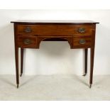 A Georgian mahogany bow front dressing table, with one long over two short drawers flanking an