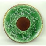 An Adams & Bromley majolica bread board, late 19th century,  moulded to the top with a hunting