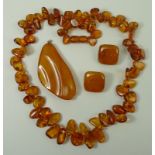 A string of highly polished deep honey coloured amber, 57cm, 43.8g, a pair of vintage square form