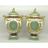 A pair of Wedgwood porcelain vases and covers, late 19th century, of twin handled baluster form,