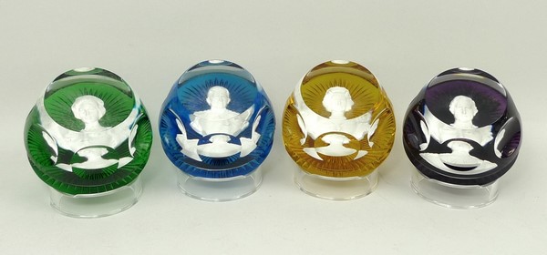 A set of four Baccarat sulphide faceted glass commemorative paperweights bearing portraits of HM