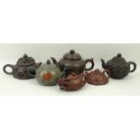 A group of six Chinese Yixing pottery teapots, two with marbled decoration, one reticulated with a