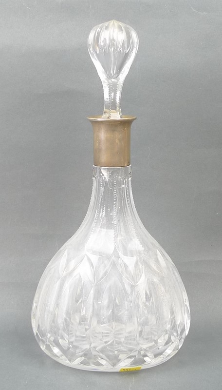 A German cut glass decanter, with an 800 grade silver collar, with original stopper, 33cm high.