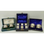 A set of six silver napkin rings with bright cut decoration, initial engraved, Birmingham 1906,
